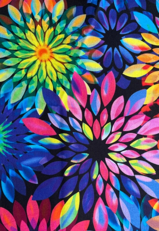 Kaleidoscope Dream fabric is a vibrant multicolor floral print on a black background